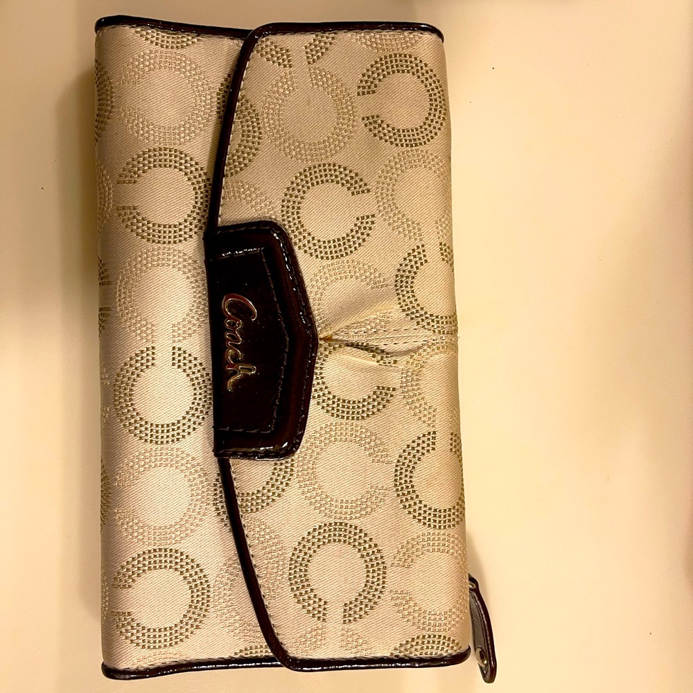 Coach checkbook size wallet. Beige with dark brown leather trim.
